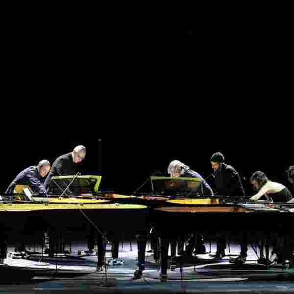 Voices at the End for six pianos